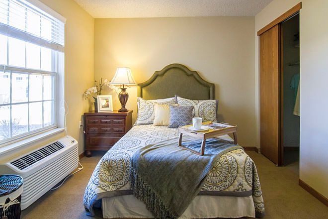 Interior design of a cozy bedroom at Brookdale Fort Collins senior living community.