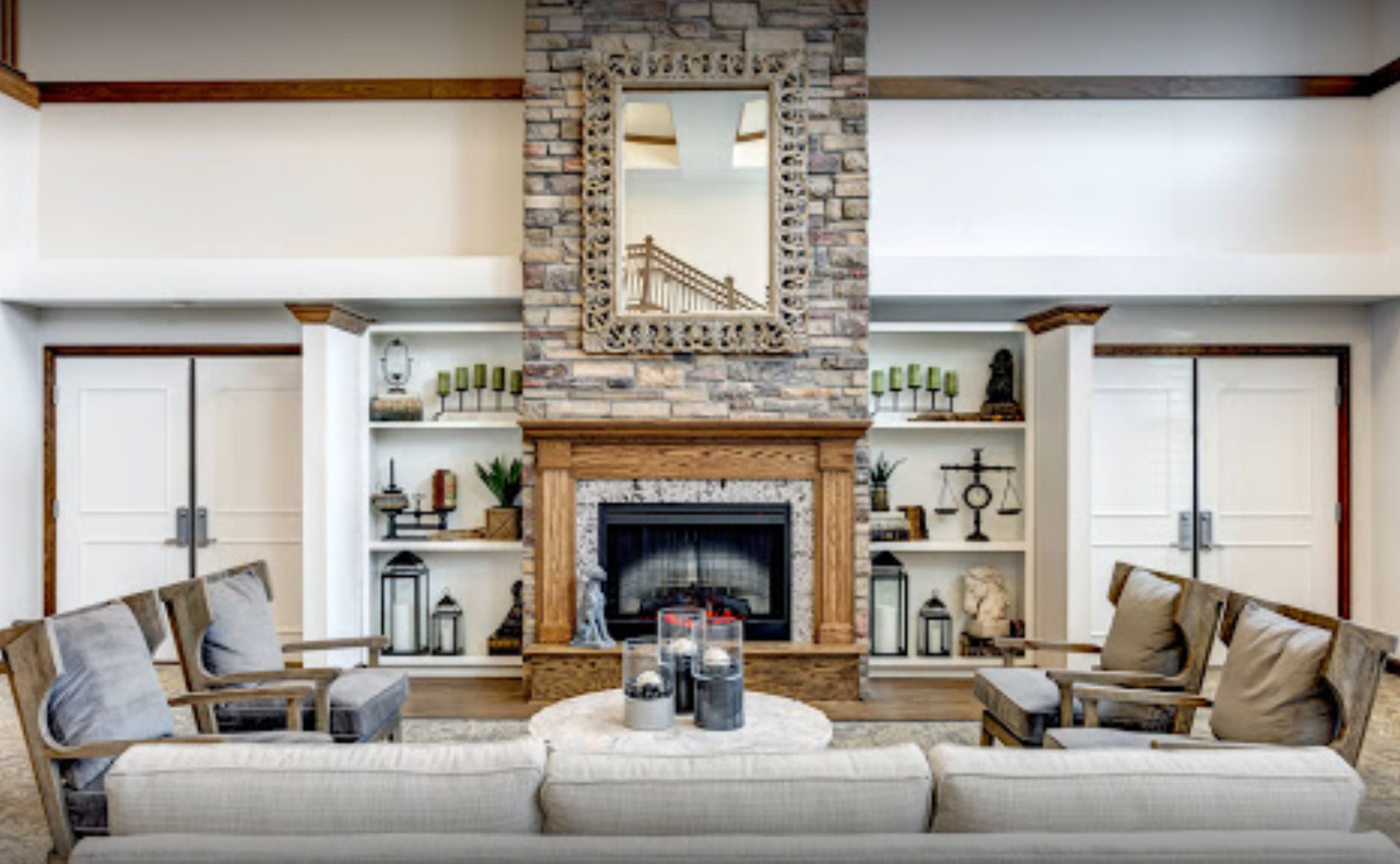 Interior view of Cedarhurst of Naperville senior living community featuring home decor, fireplace, and furniture.