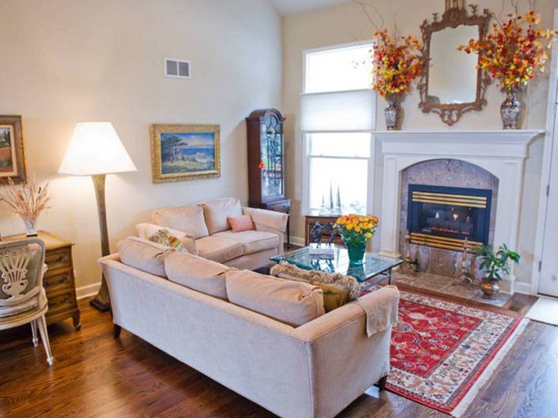 Interior view of Wyndemere senior living community featuring cozy decor, fireplace, and furniture.