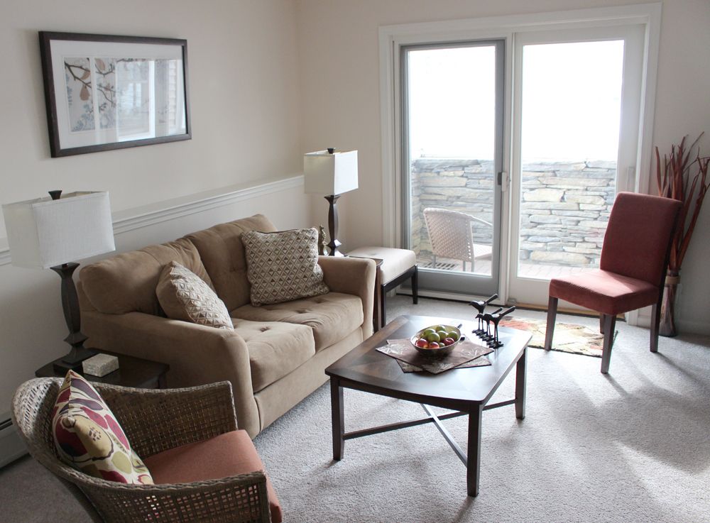 Interior view of Lathrop Community Inc. senior living room with modern furniture and home decor.