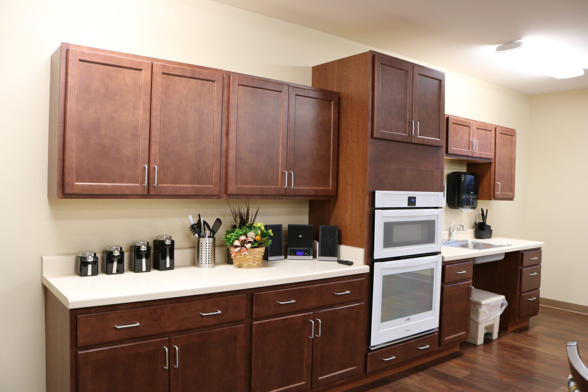 Interior view of Lacey Creek Supportive Living with modern kitchen appliances and furniture.