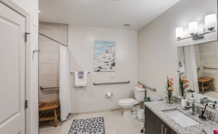 Interior design of a bathroom with modern decor in the Inspired Living Royal Palm Beach senior community.