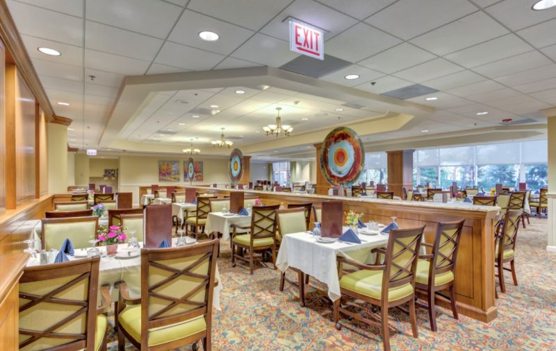 Interior view of The Moorings of Arlington Heights senior living community featuring dining area.