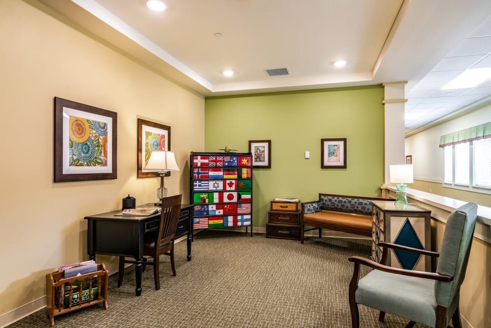 Senior living community interior at Harvester Place featuring art, furniture, and home decor.