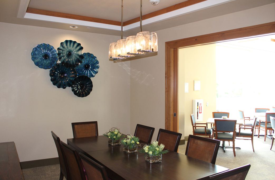 Interior view of The Plaza at Waikiki senior living community featuring elegant dining room design.