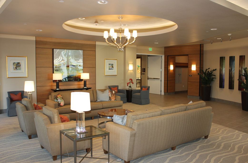 Senior living community reception area at The Plaza at Waikiki featuring elegant decor and furniture.