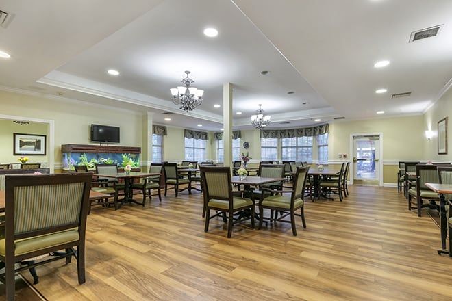 Interior view of Brookdale Germantown senior living community featuring dining area, art, and tech amenities.
