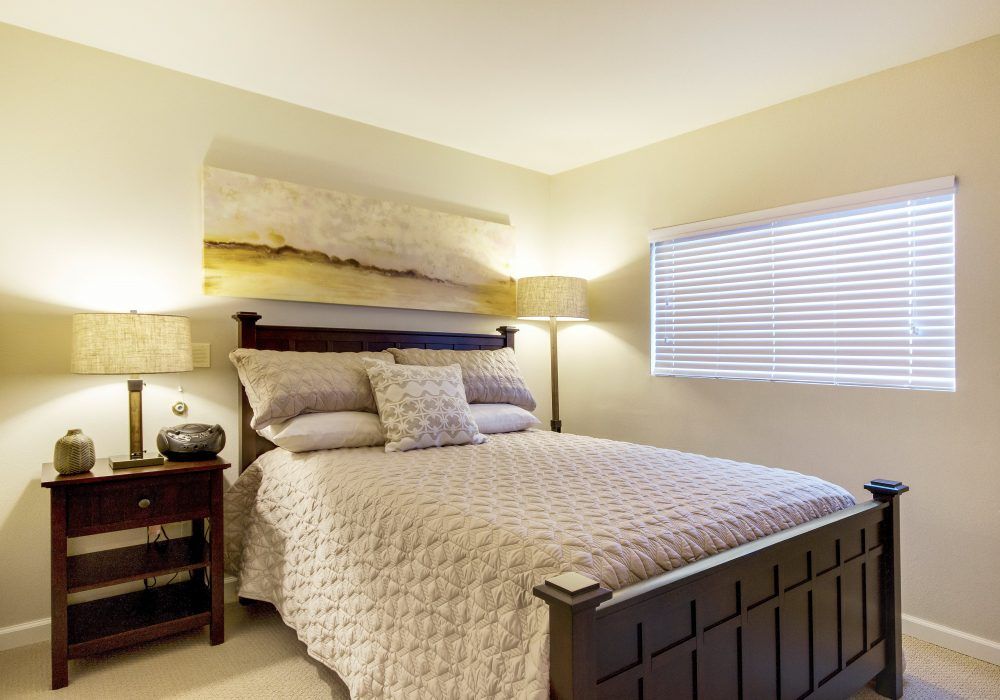 Interior design of a cozy bedroom at Fairwinds Ivey Ranch senior living community.