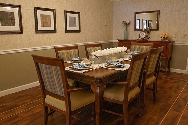 Interior view of Brookdale Emerson senior living community featuring a wooden dining room.