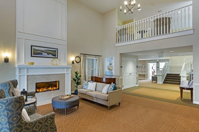 Interior view of Brookdale Cushing Park senior living community featuring cozy decor and architecture.