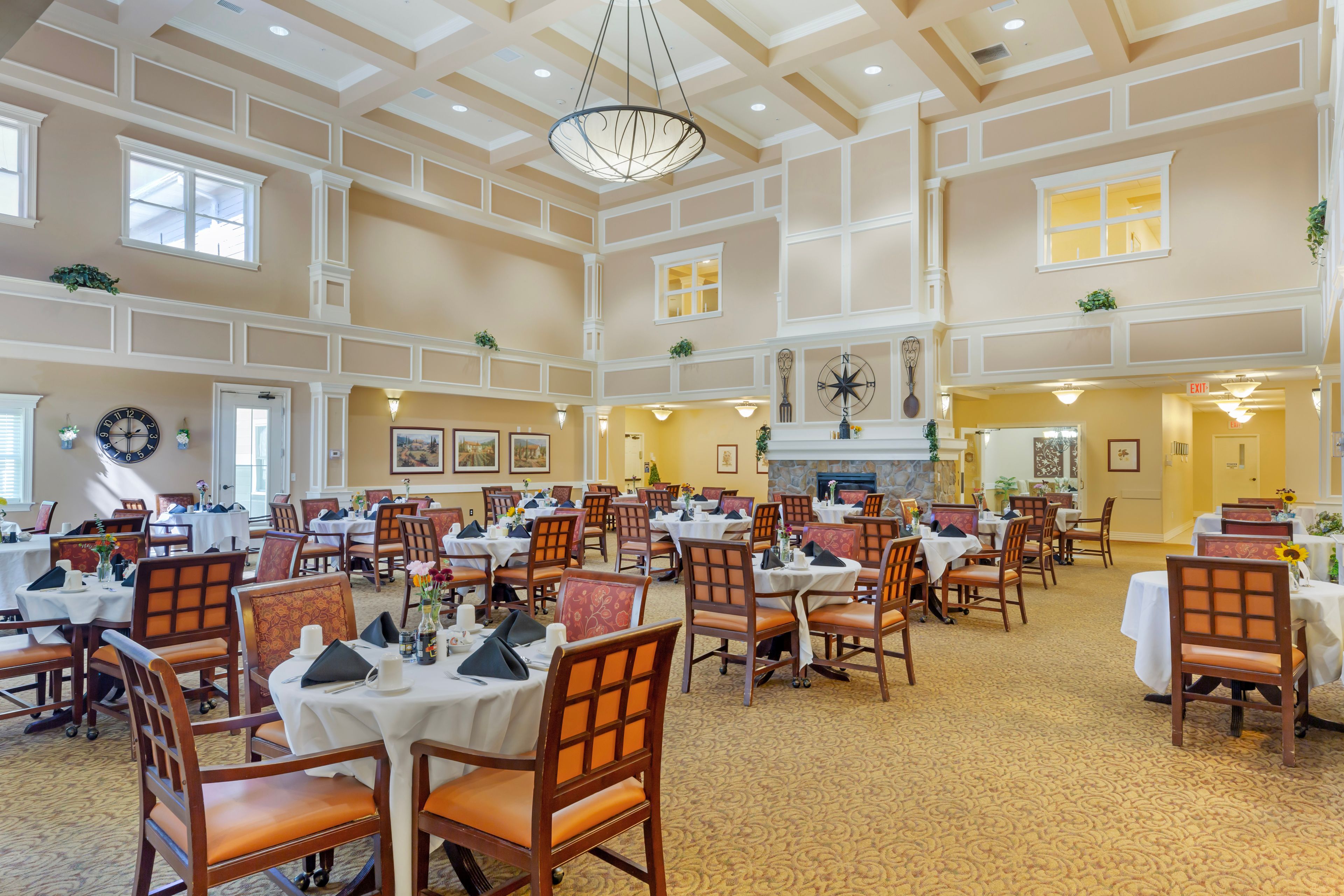 Interior view of Brookdale Centre of New England featuring dining area, art, and modern decor.
