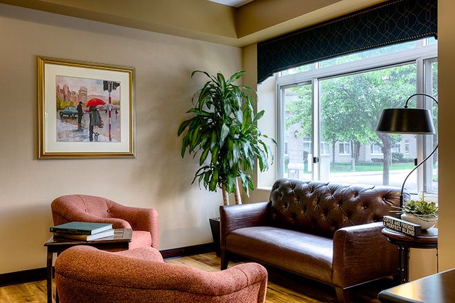 Senior living room interior at Brookdale Northbrook with cozy furniture, books, and home decor.