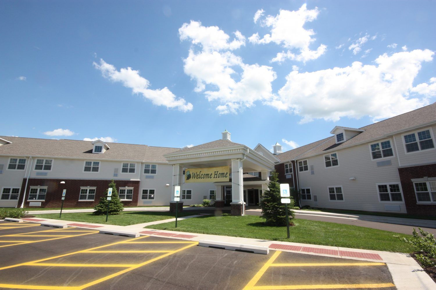 Heritage Woods of Freeport senior living community with urban condos, office buildings, and school.