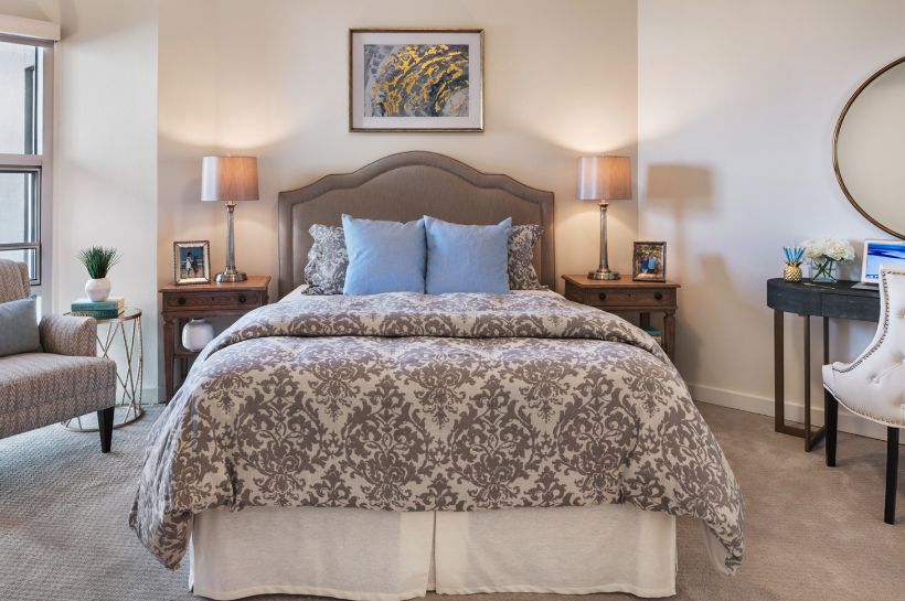 Interior design of a bedroom in The Village at The Triangle senior living community.