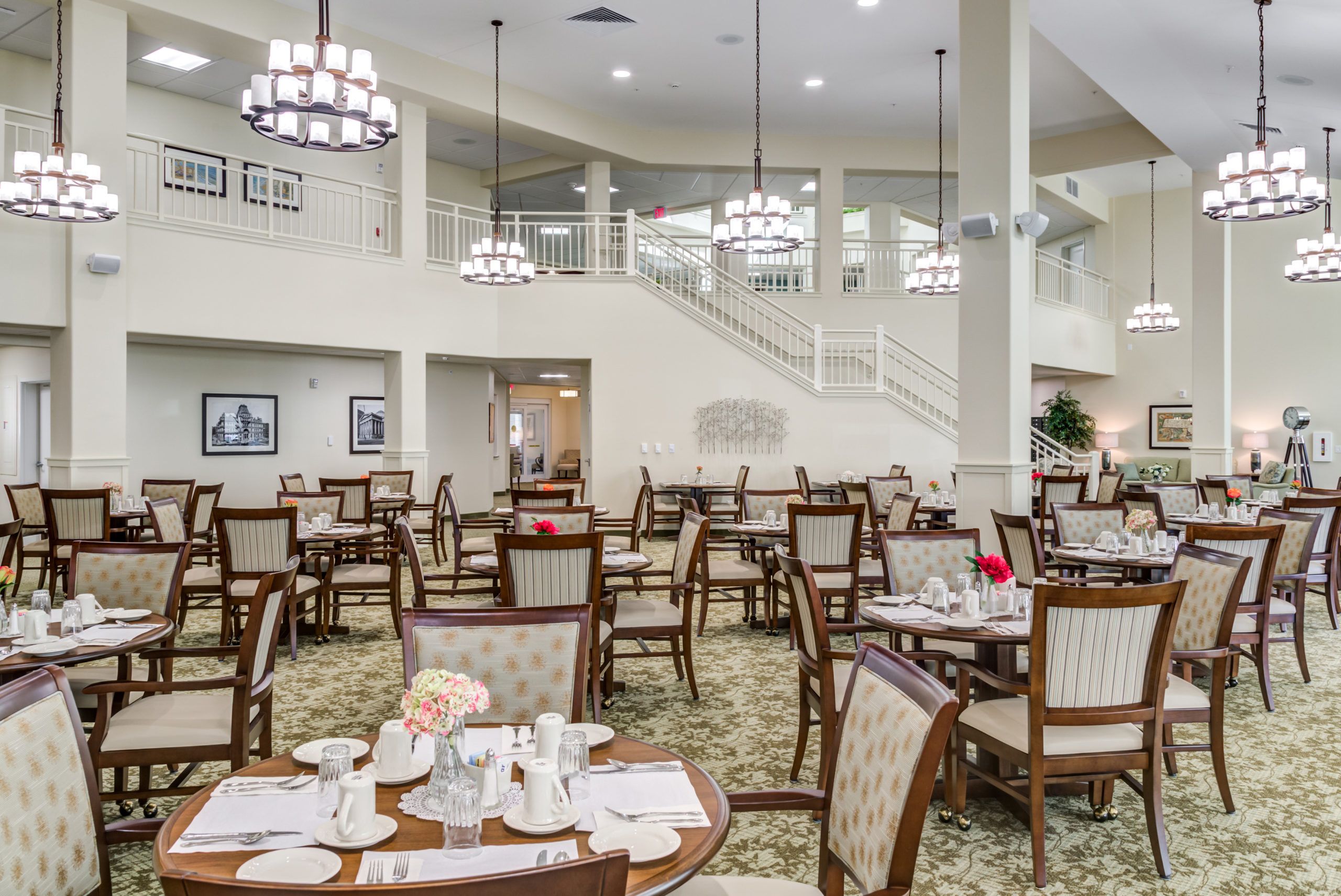 Seniors enjoying a meal in the elegant dining room at Camellia Gardens Gracious Retirement Living.