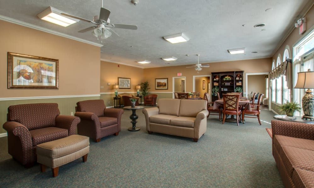 Senior living community reception room with modern furniture, art, and home decor.