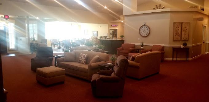Senior living community interior at The Cottages at Lochsa Falls featuring cozy furniture and decor.