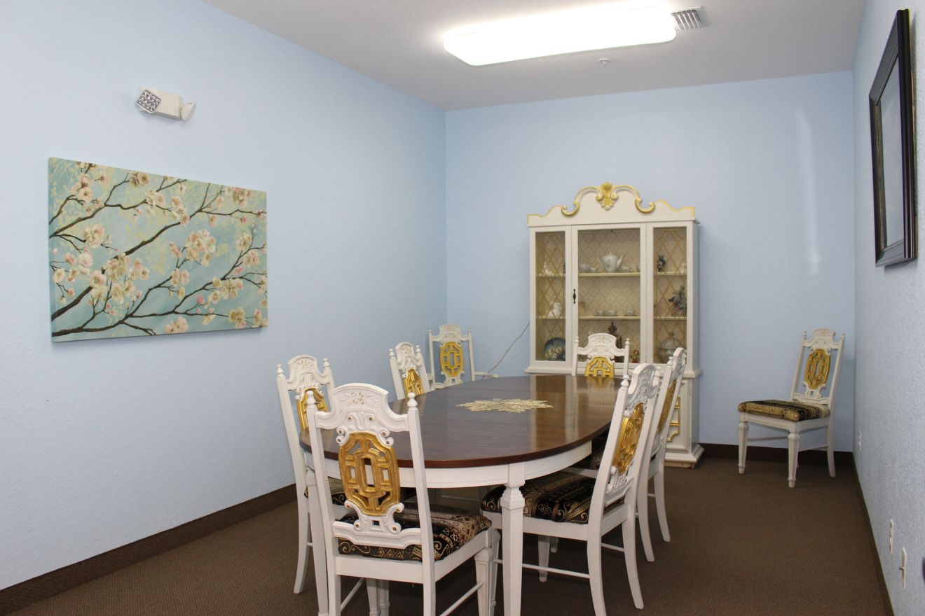 Interior view of Marion Oaks Assisted Living featuring dining room with furniture and modern design.