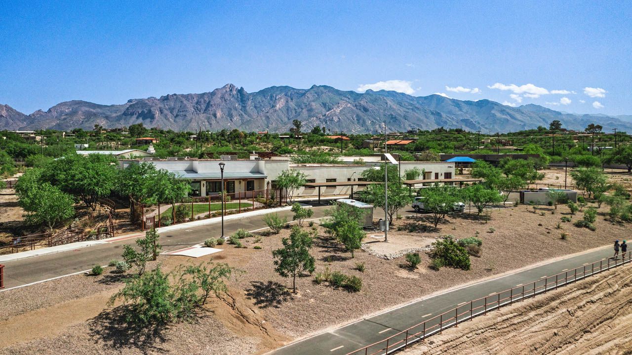 Senior living community, The Hacienda At The River, amidst urban and rural scenery.