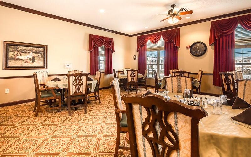 Interior view of Bickford of Okemos senior living community featuring dining room decor.