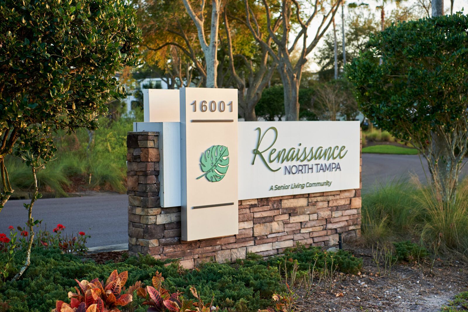 Renaissance North Tampa senior living community surrounded by lush park, trees, and wildlife.