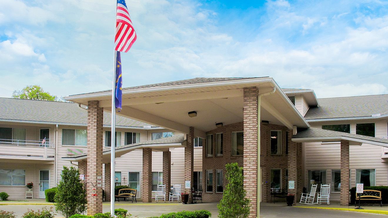Holiday at Willow Park senior living community showcasing its architectural buildings and outdoor shelter.
