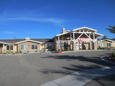 Senior living community, Sunny Rose Glen, showcasing urban architecture in a suburban setting.