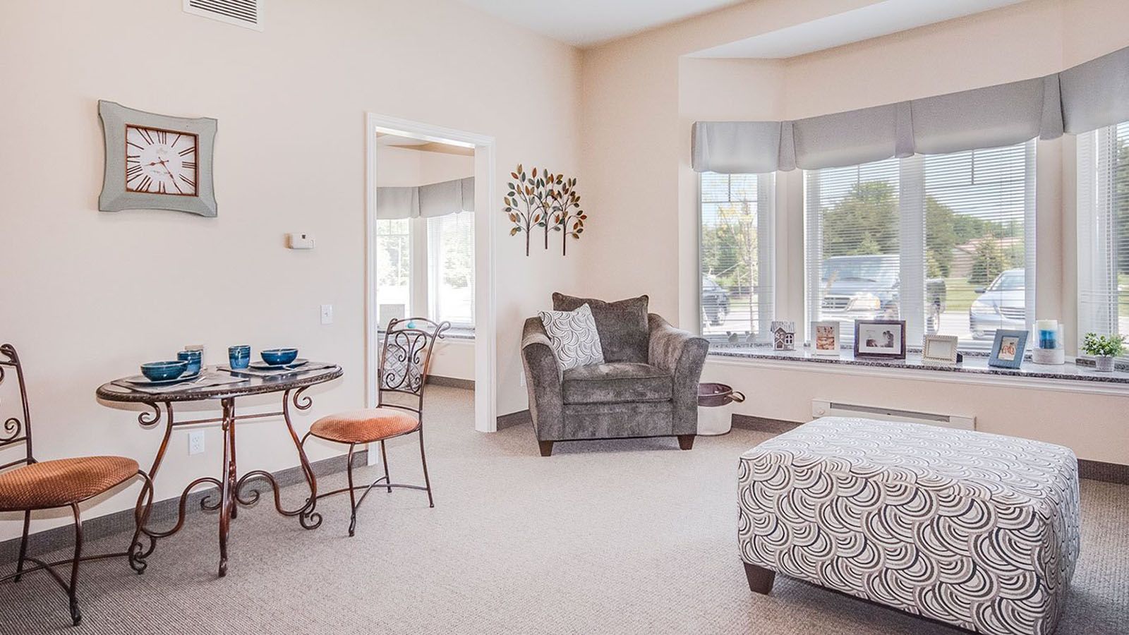 Senior living community, Grandhaven Living Center, featuring home decor, furniture, bay window view.