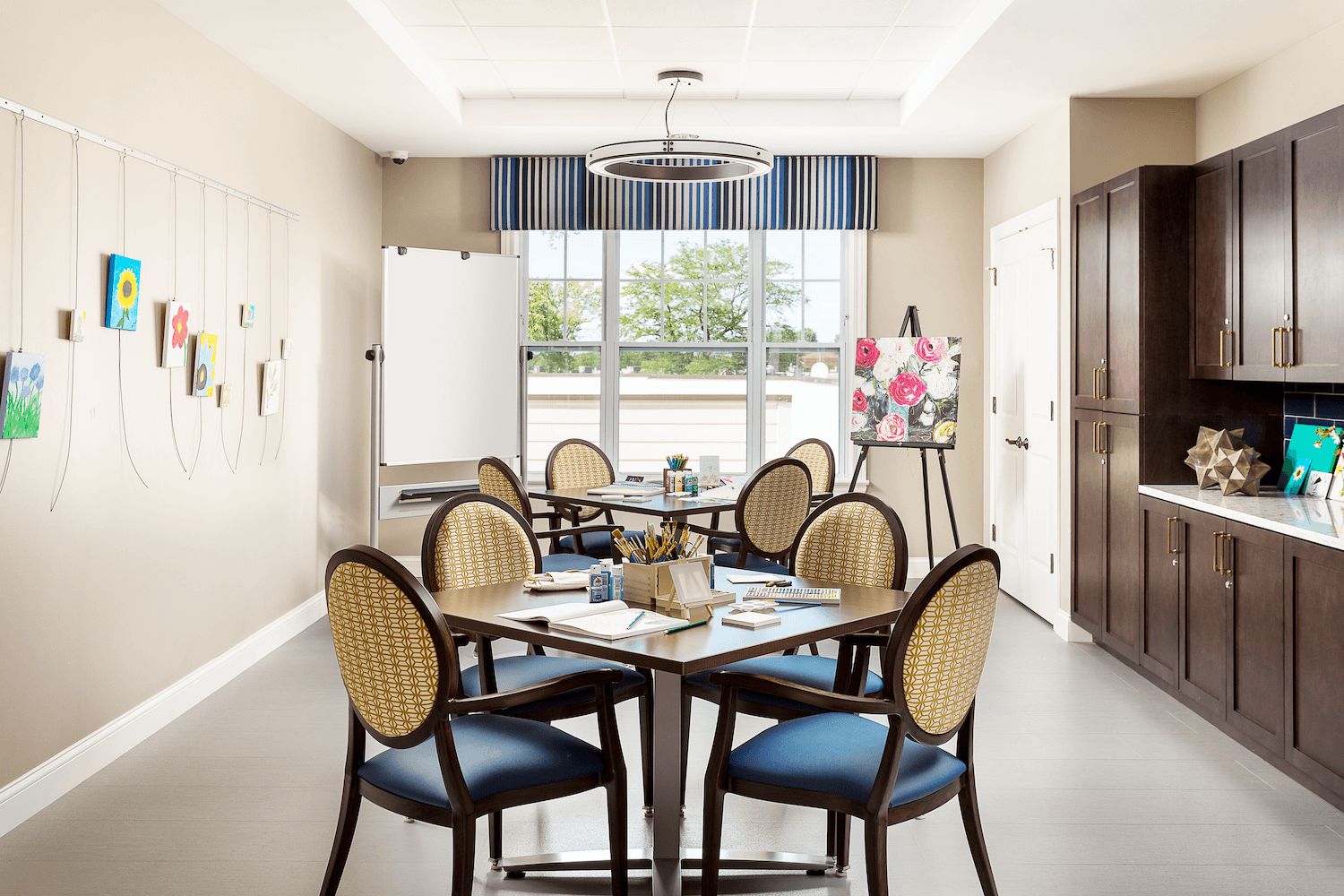 Interior view of Arbor Terrace Glenview senior living community featuring dining room and kitchen decor.