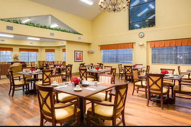 Interior view of Brookdale New Port Richey senior living community featuring a well-furnished dining area.