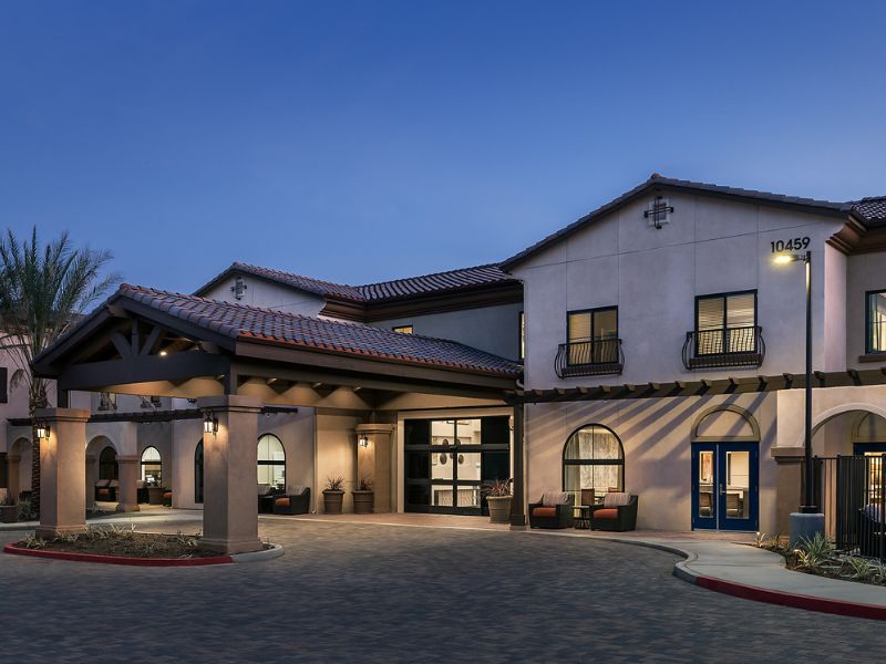 Senior living community, Cadence At Rancho Cucamonga, featuring modern architecture and lush greenery.