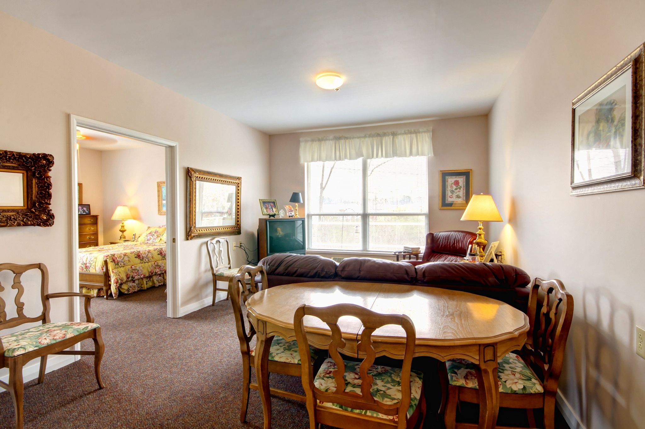 Interior view of Branchwater Village Senior Living Community featuring dining room, living room and decor.