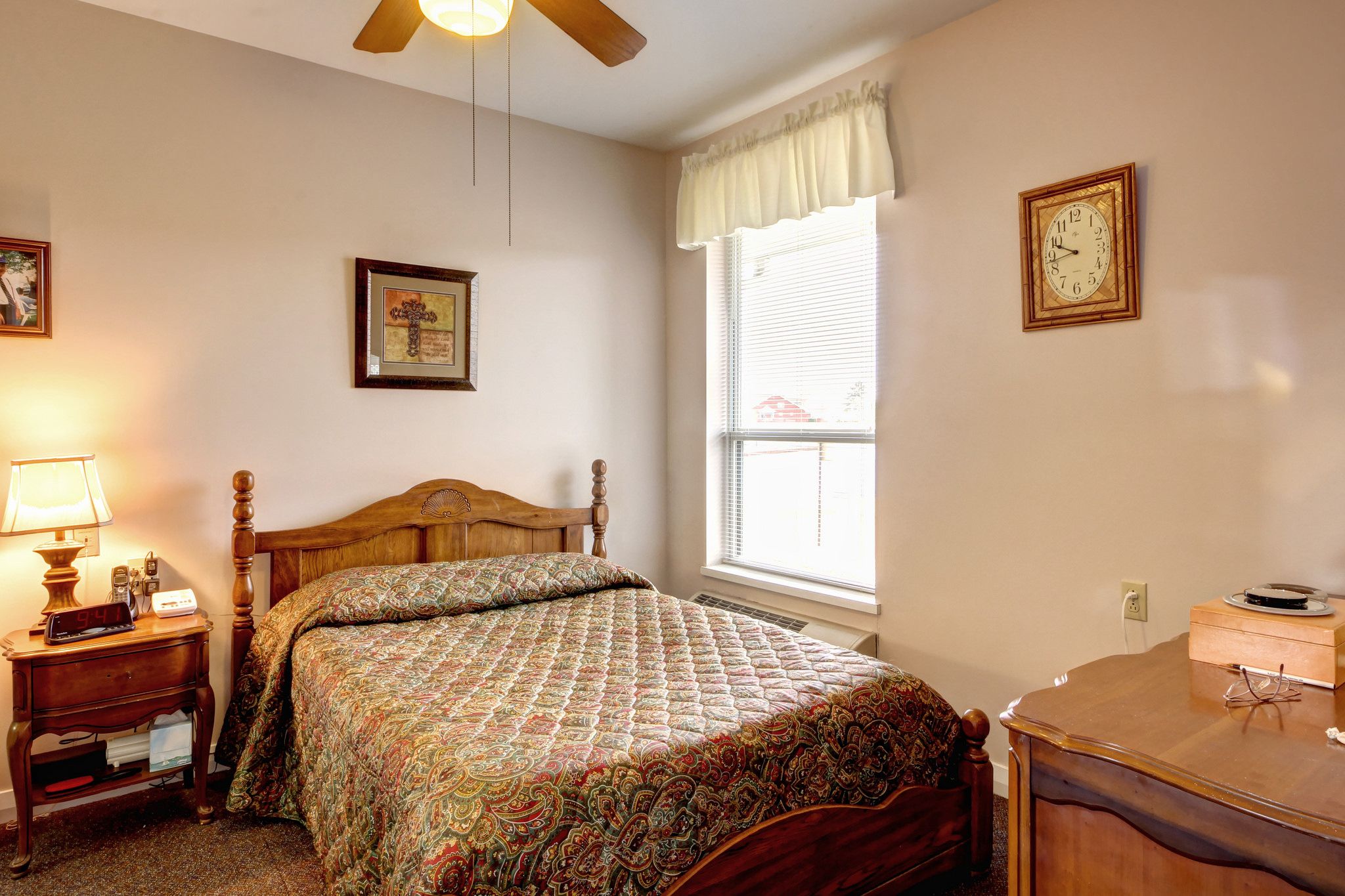 Interior design of a bedroom in Branchwater Village Senior Living with bed, furniture, and home decor.