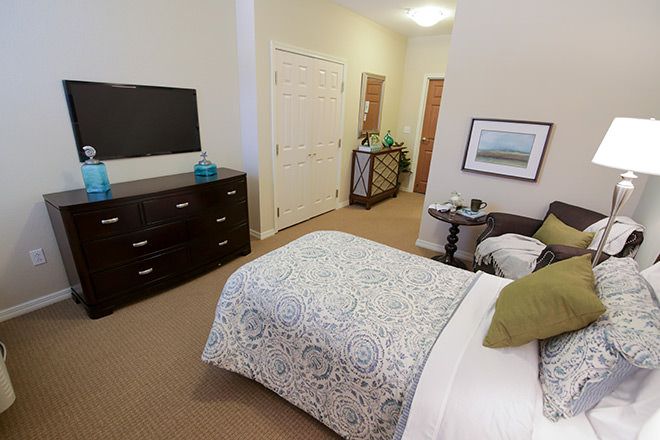 Interior view of a furnished bedroom at Brookdale St. Augustine senior living community.