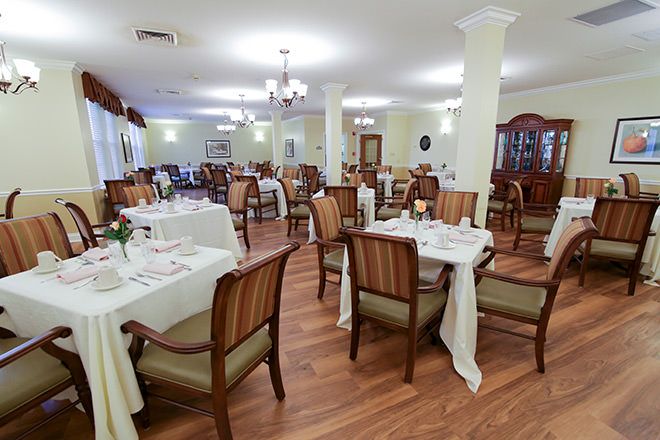 Interior view of Brookdale St. Augustine senior living community featuring dining and reception areas.