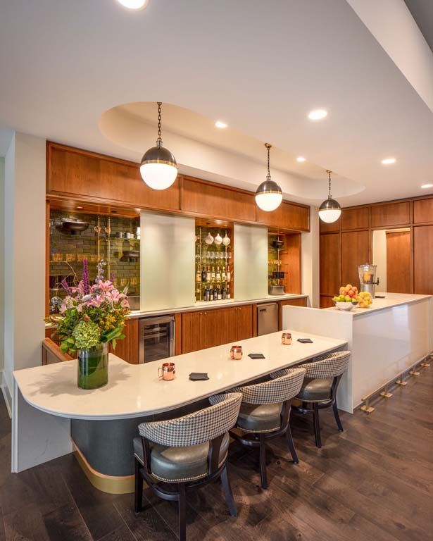 Interior design of The Sheridan at River Forest senior living community featuring kitchen, dining area, and bar.