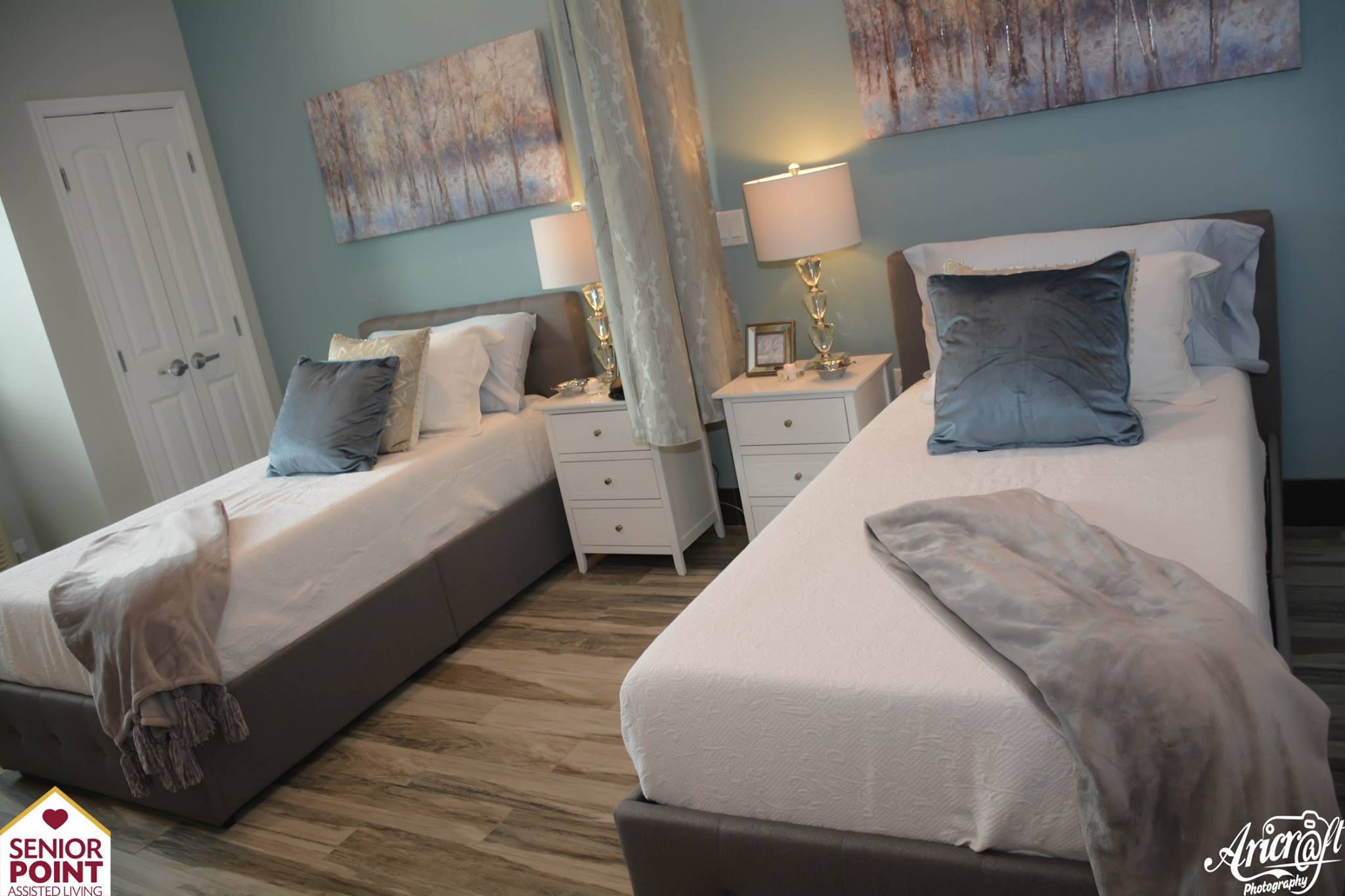 Interior view of Senior Point Assisted Living Facility featuring cozy bedroom decor and architecture.