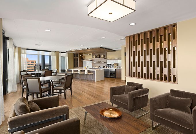 Interior view of Brightview West End senior living community featuring dining and living room decor.