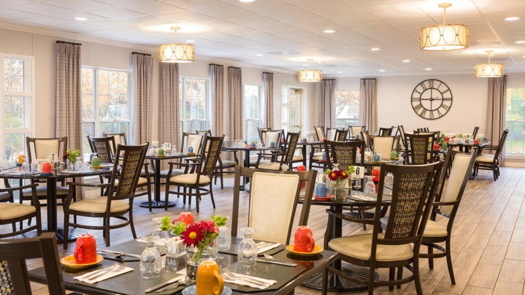 Belmont Village Senior Living Buffalo Grove featuring dining room with elegant furniture.