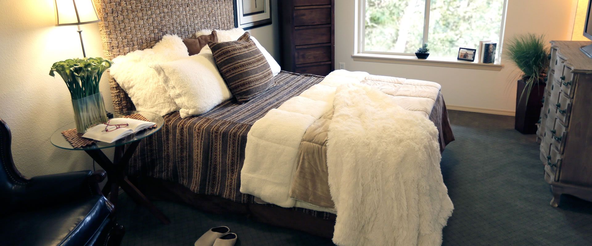 Senior living bedroom interior at Highgate, Prescott Lakes with elegant furniture and decor.