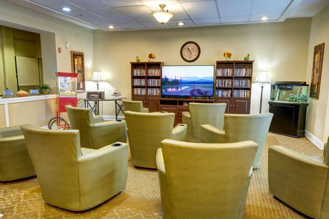 Senior living community lounge with modern furniture and electronics in Whispering Winds, Apple Valley.