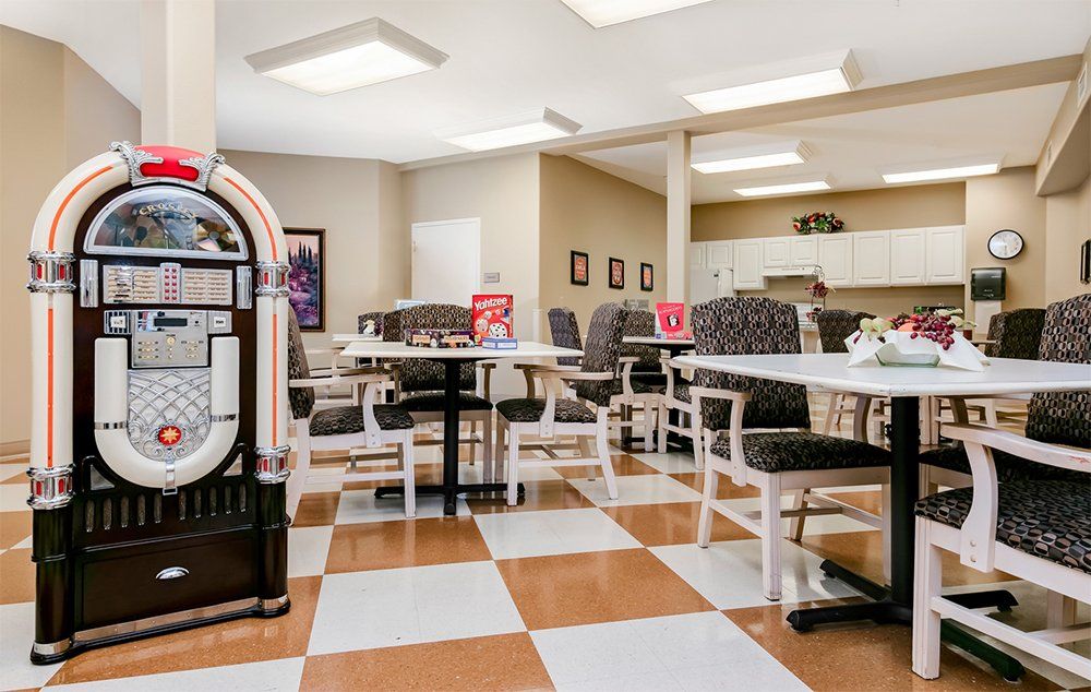 Interior view of MorningStar of Boise senior living community featuring dining area and electronics.