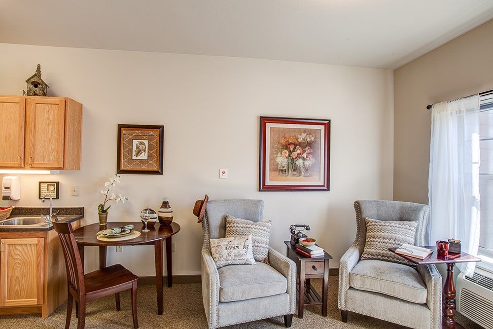 Senior living room interior at MorningStar of Boise featuring cozy furniture, art, and decor.
