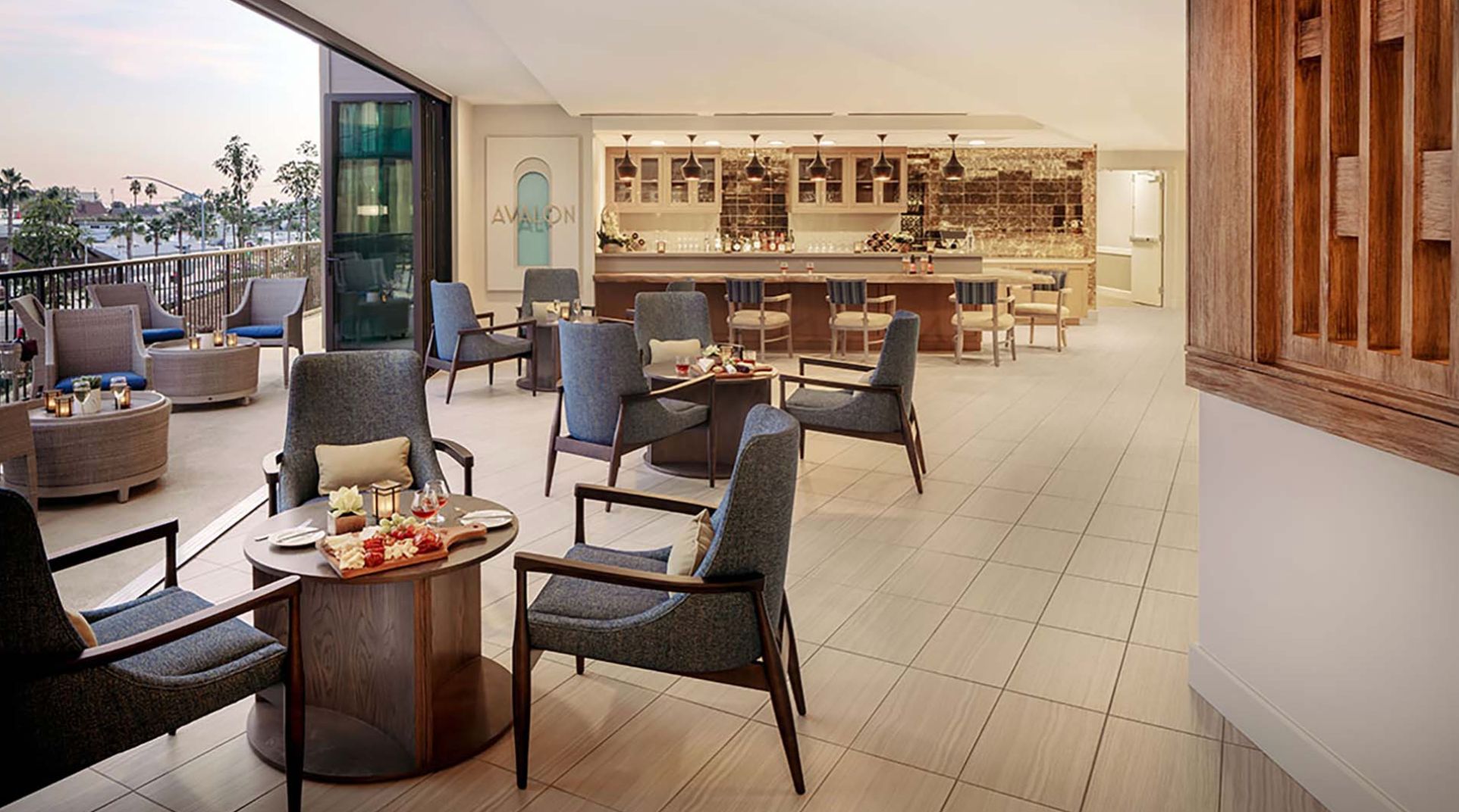 Interior view of Atria Newport Beach senior living community featuring dining room and lounge.