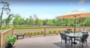 Scenic view of SummerHouse Bay Cove senior living community with beautiful architecture and outdoor spaces.