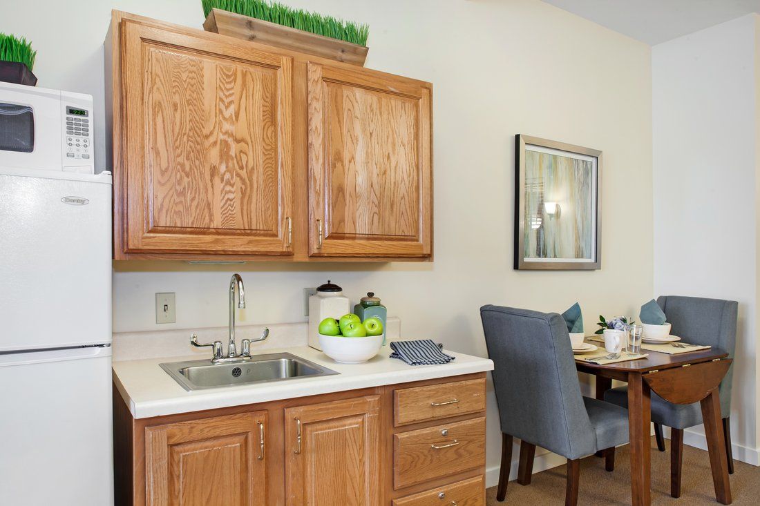 Interior view of Sunrise of Lenexa senior living community featuring a well-equipped kitchen.