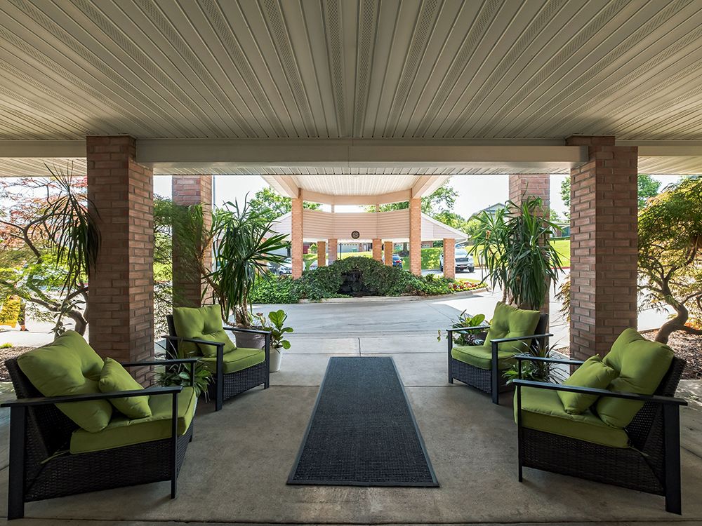 Senior living community lounge at Gardens At Arkanshire with modern furniture and decor.