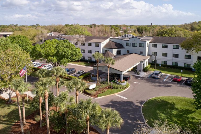Aerial view of Renaissance North Tampa senior living community with lush outdoors.