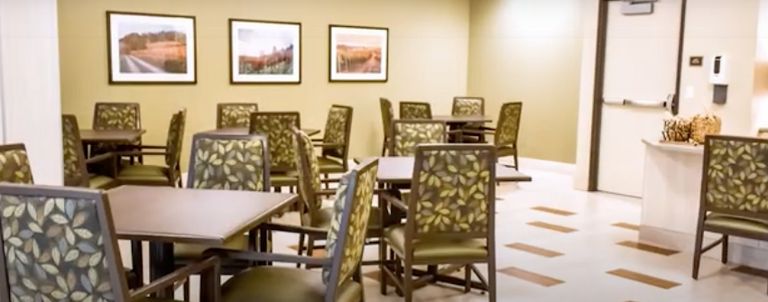 Interior view of Westmont of Milpitas senior living community featuring dining area and decor.