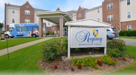 Regency Retirement of Birmingham, a senior living community with lush greenery and modern architecture.